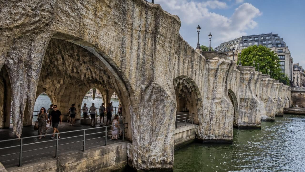 JR Transforms Paris' Pont Neuf into a Giant Cave Installation