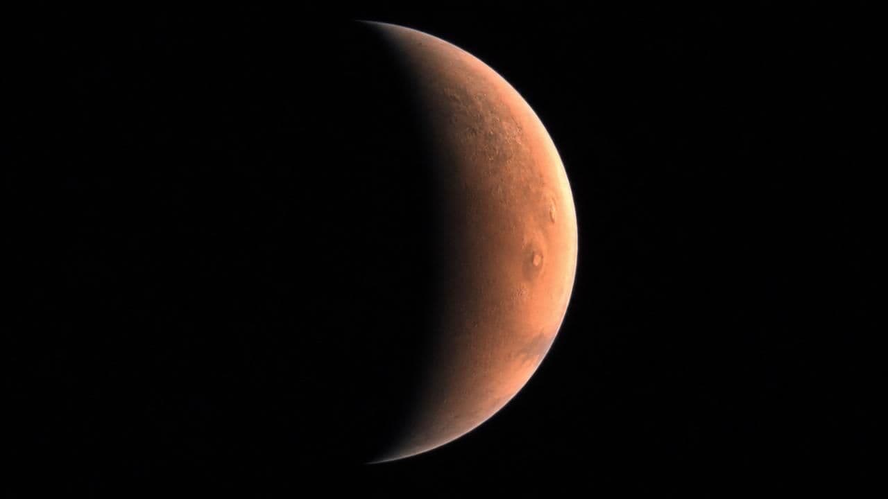 NASA's Psyche Spacecraft Captures Stunning Crescent Mars Views During Gravity Assist