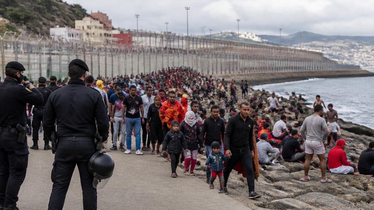Ceuta Border Crisis: Spain Blames Traffickers as Thousands Return to Morocco