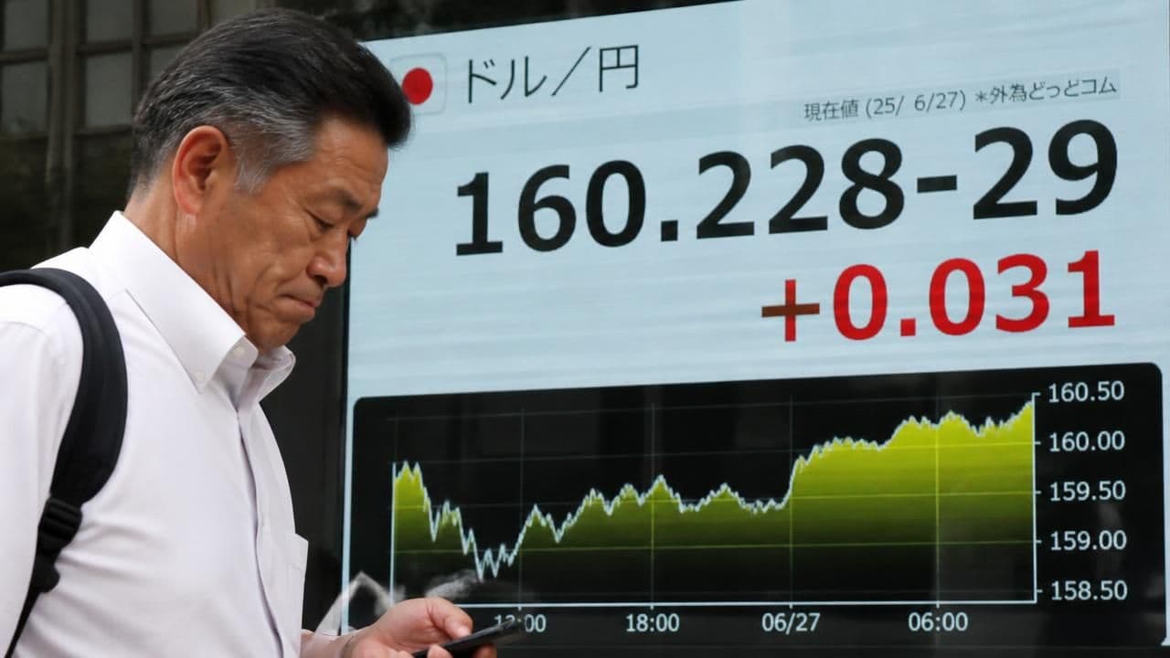 Yen's Plunge to 160 Sparks Intervention Fears as Global Markets Watch